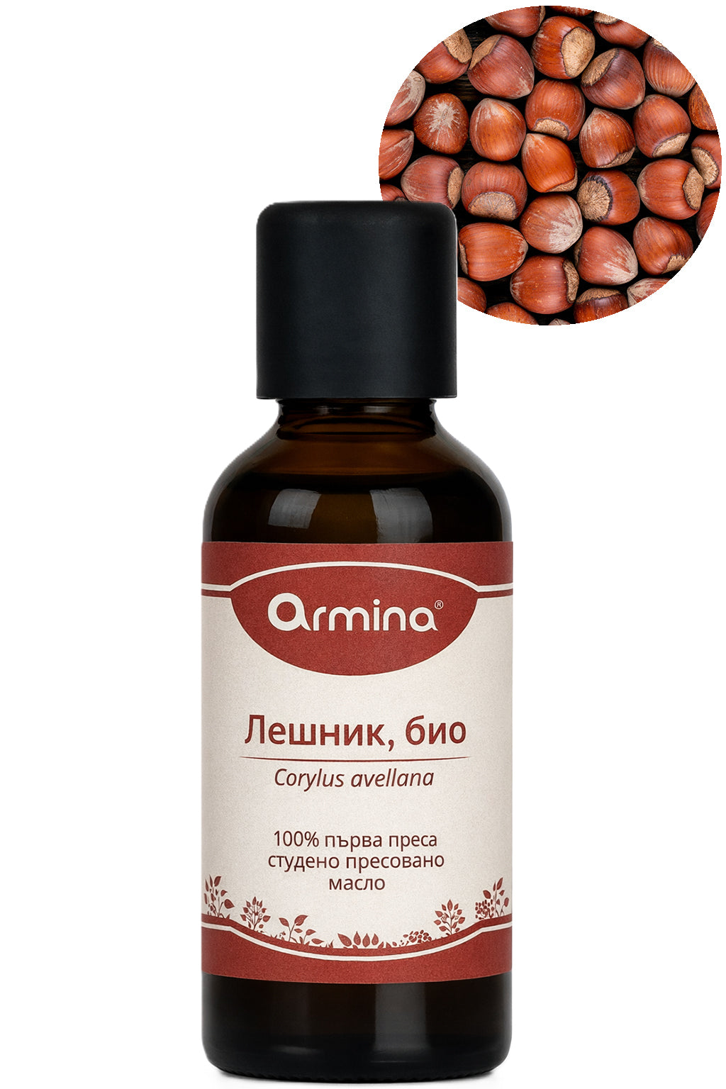 Бутилка био растително масло от лешник с етикет, до цели лешници.